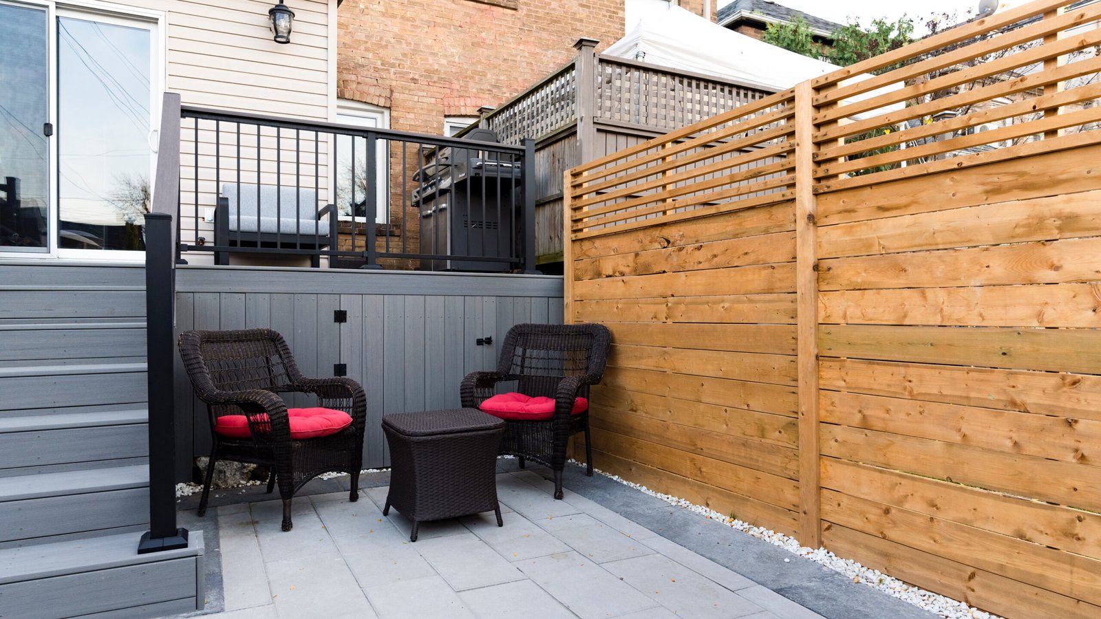 Composite deck and stone patio in Bedford Park